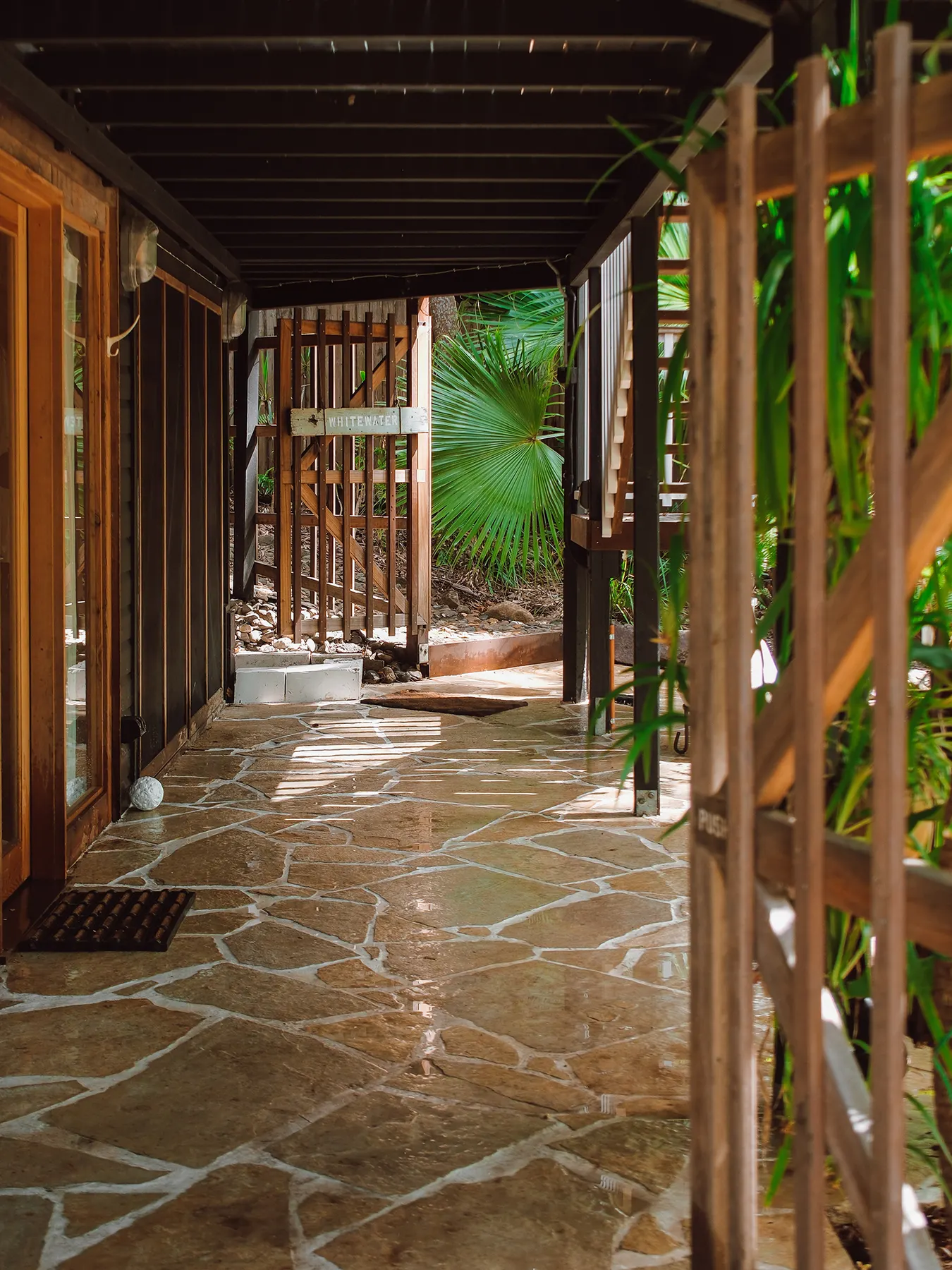 Stone path under a timber pergola