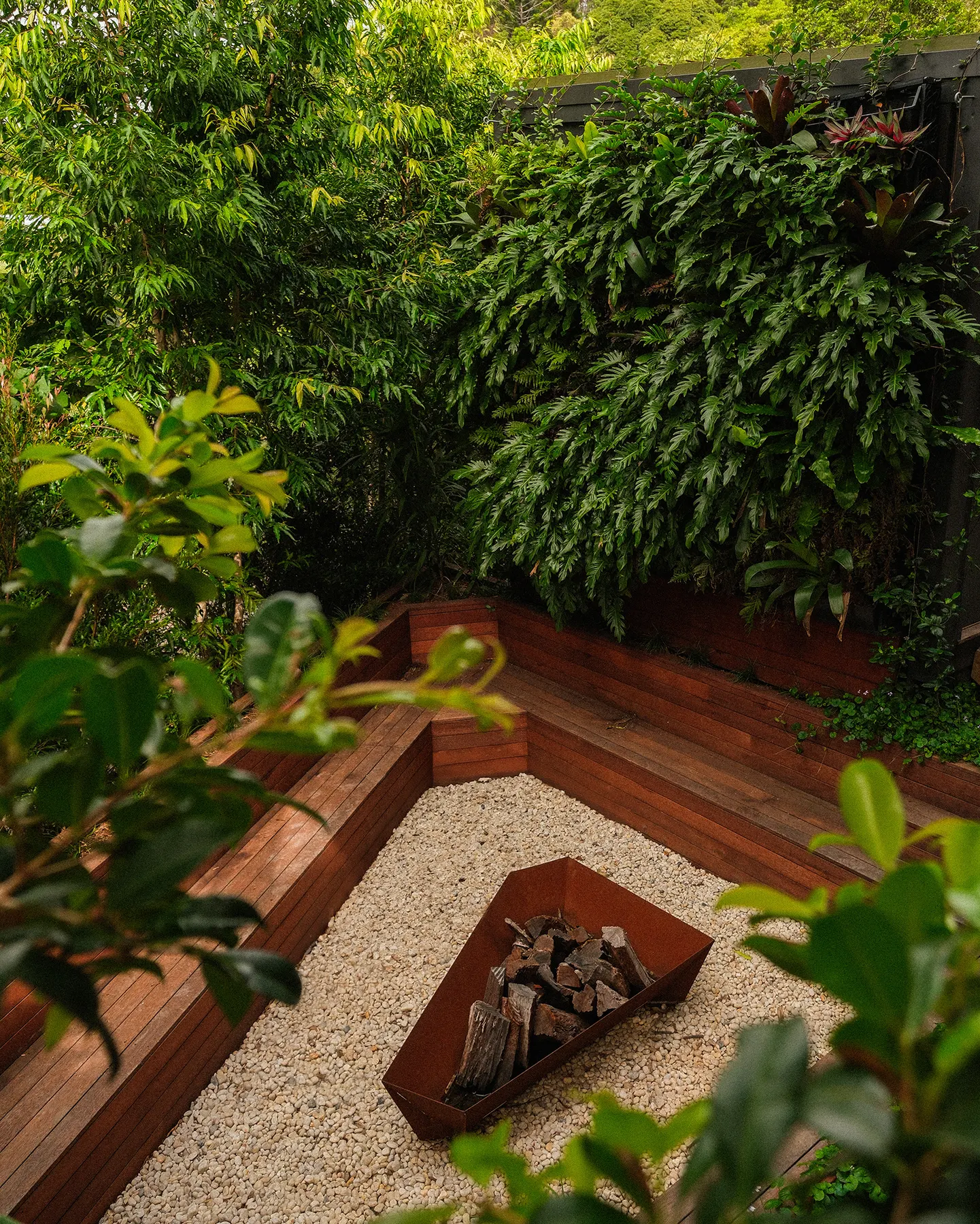 Sunken fire pit with built-in hardwood bench seating